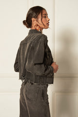 Video - The Harvey - Fatal Attraction is a cropped denim jacket in a vintage black wash with destruction. Made with GRS-certified recycled cotton.
